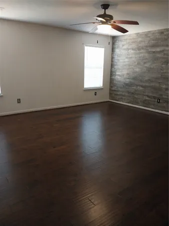 a bathroom with a double vanity sink and a window