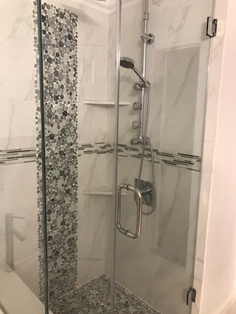 a bathroom with a bathtub and a shower