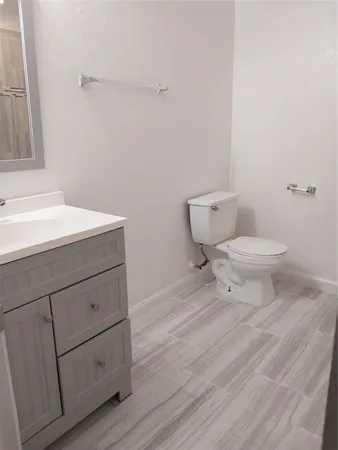a bathroom with a shower a bathtub