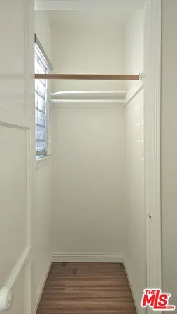 a bathroom view wooden floor and a window