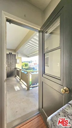 a bathroom with a tub mirror and window
