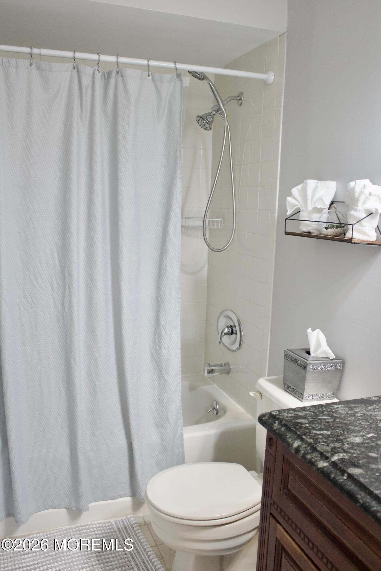 33 Balmoral Court Matawan, NJ 07747 - Photo 12 of 20 a bathroom with a granite countertop sink and a toilet