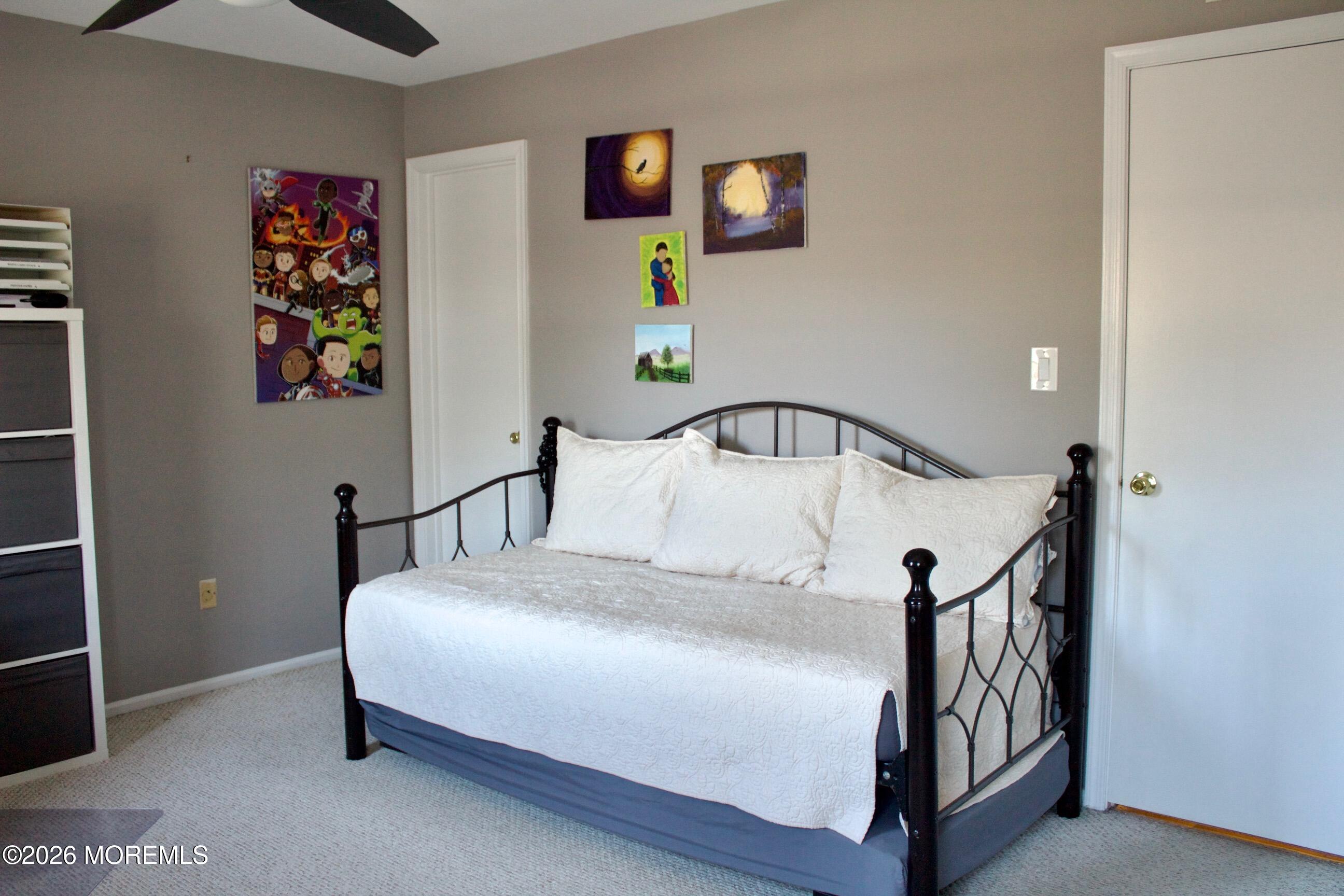 33 Balmoral Court Matawan, NJ 07747 - Photo 13 of 20 a bedroom with a bed and a potted plant on dresser