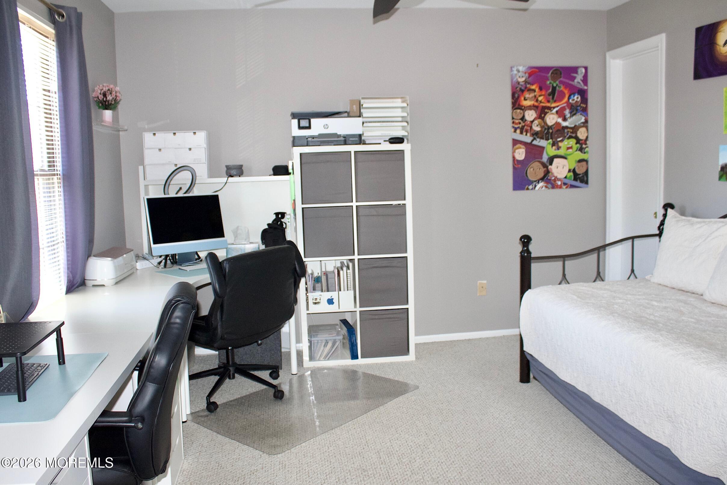 33 Balmoral Court Matawan, NJ 07747 - Photo 14 of 20 a bedroom with a bed and a flat screen tv