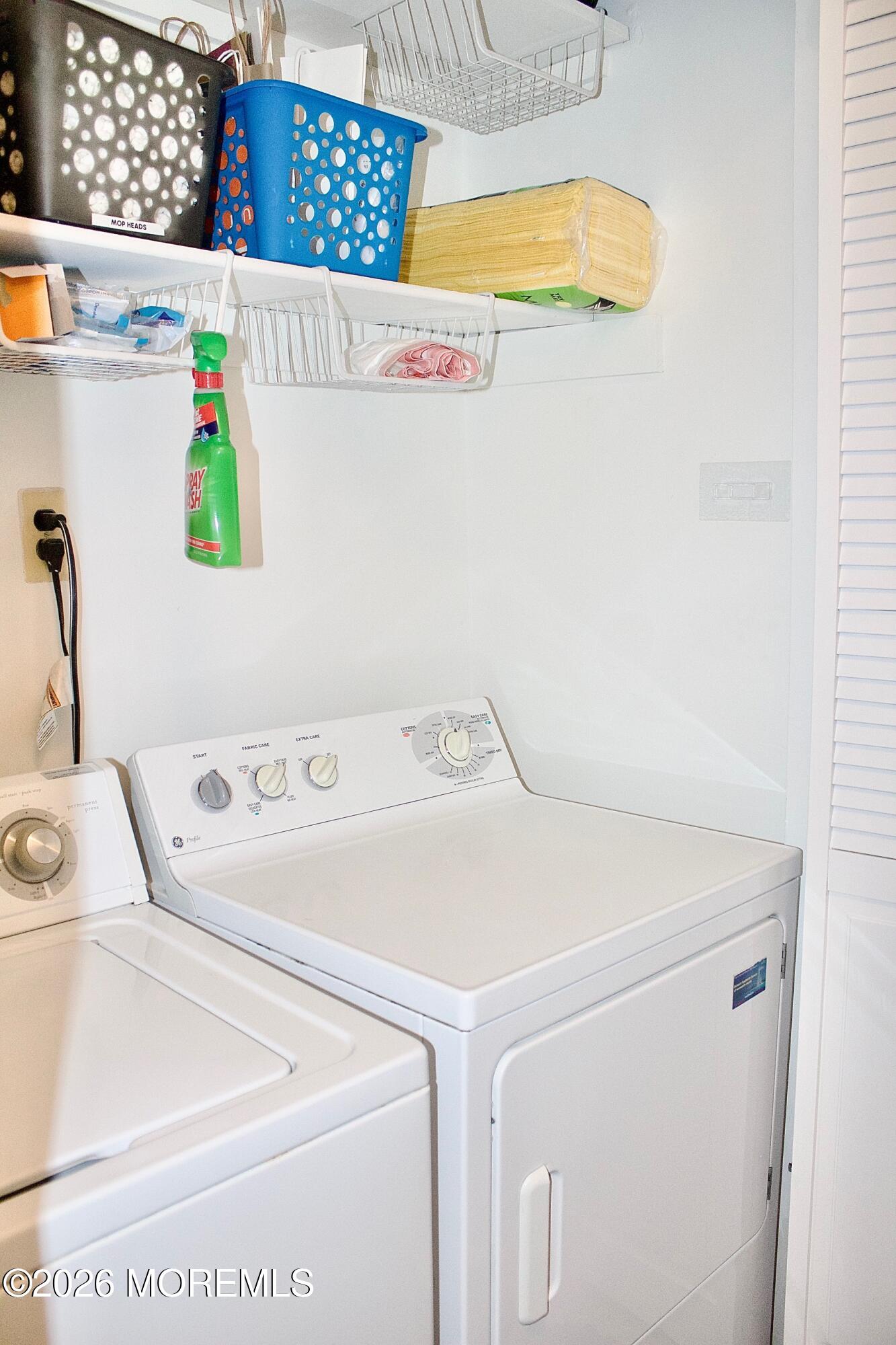 33 Balmoral Court Matawan, NJ 07747 - Photo 16 of 20 a utility room with dryer and washer