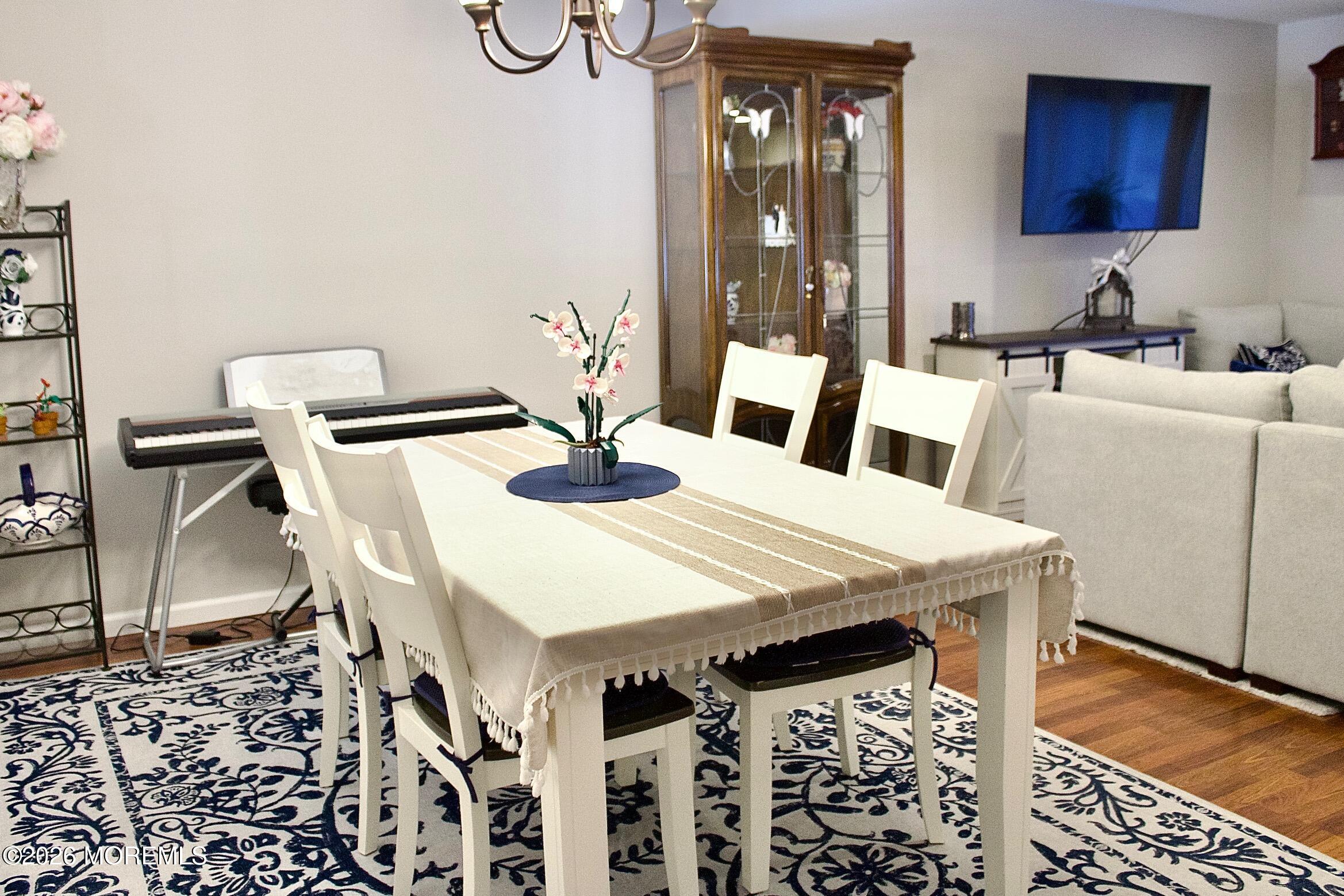 33 Balmoral Court Matawan, NJ 07747 - Photo 7 of 20 a dining room with furniture and wooden floor