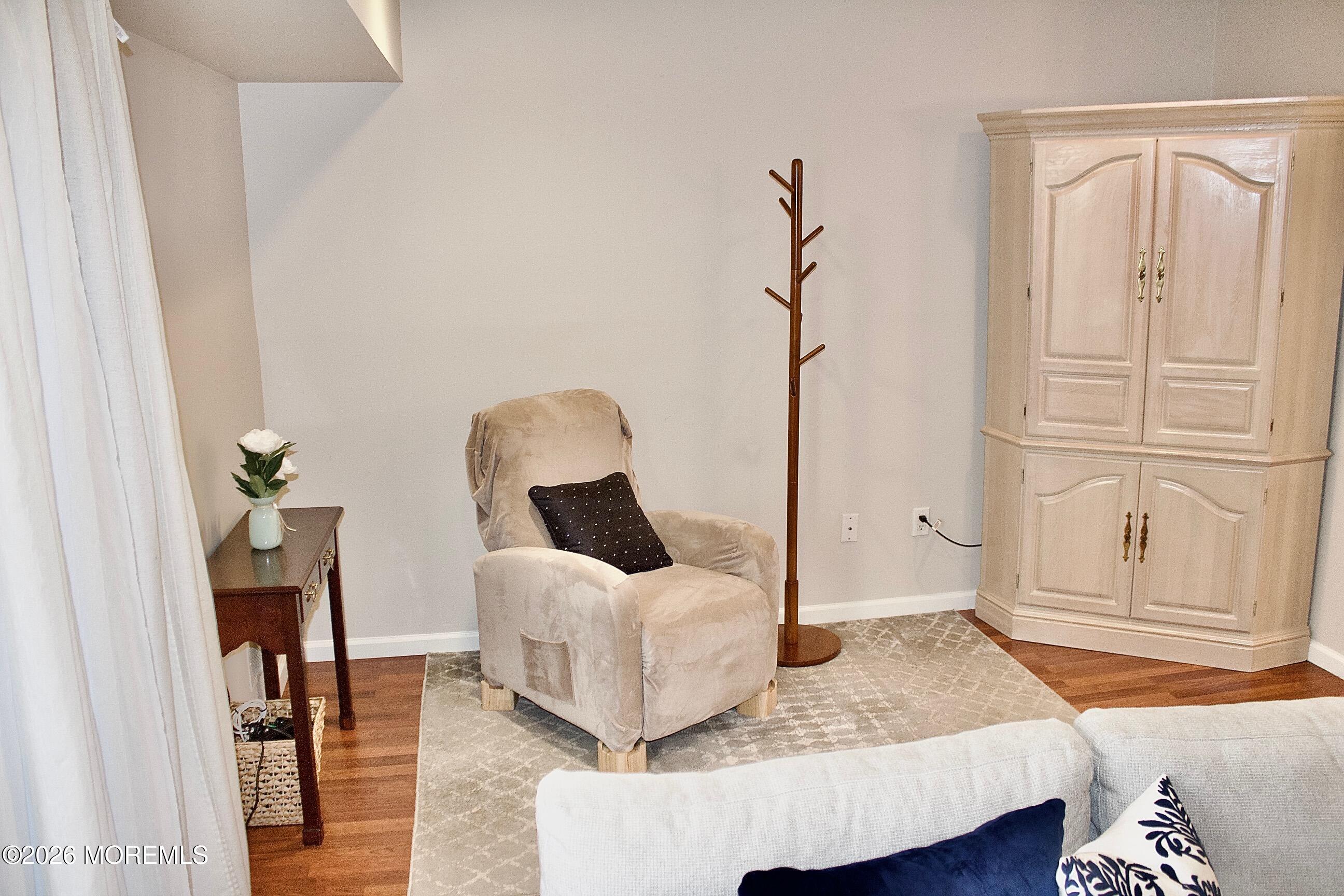 33 Balmoral Court Matawan, NJ 07747 - Photo 9 of 20 a bedroom with a bed and wooden floor
