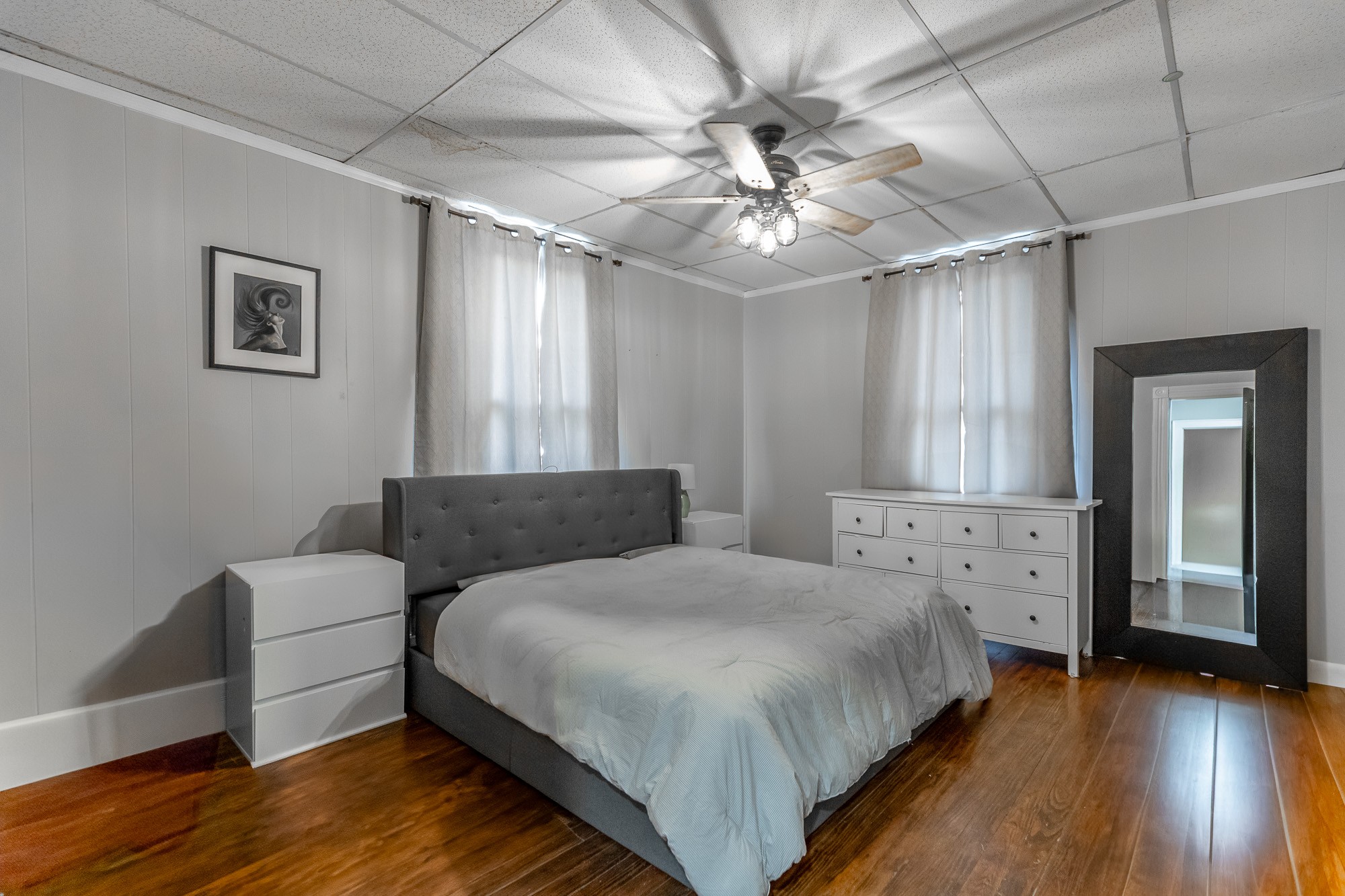 407 Colville Street Chattanooga, TN 37405 - Photo 12 of 50 a bedroom with a large bed and a chandelier