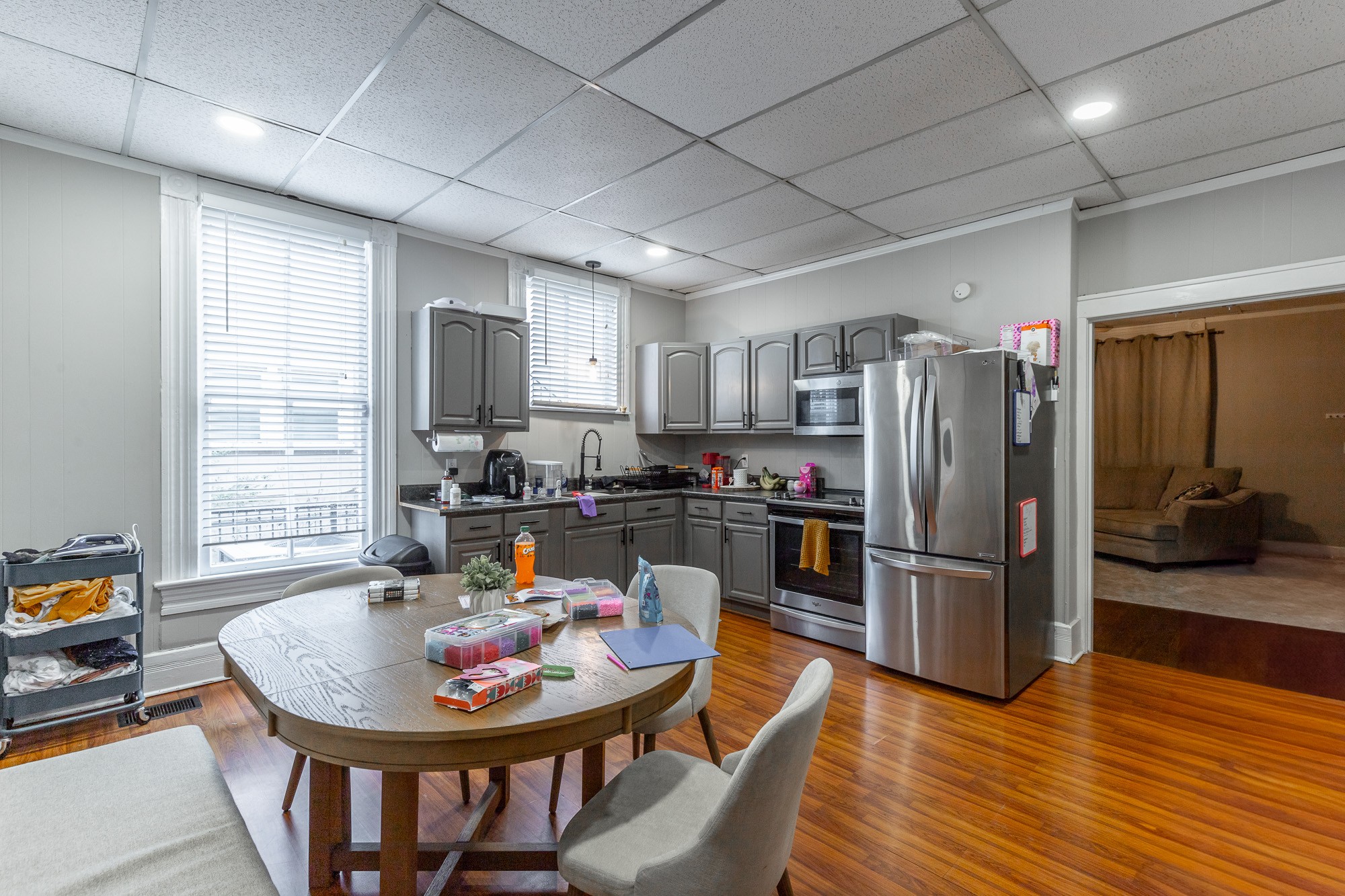 407 Colville Street Chattanooga, TN 37405 - Photo 7 of 50 a kitchen with stainless steel appliances granite countertop a refrigerator a stove a sink a dining table and chairs