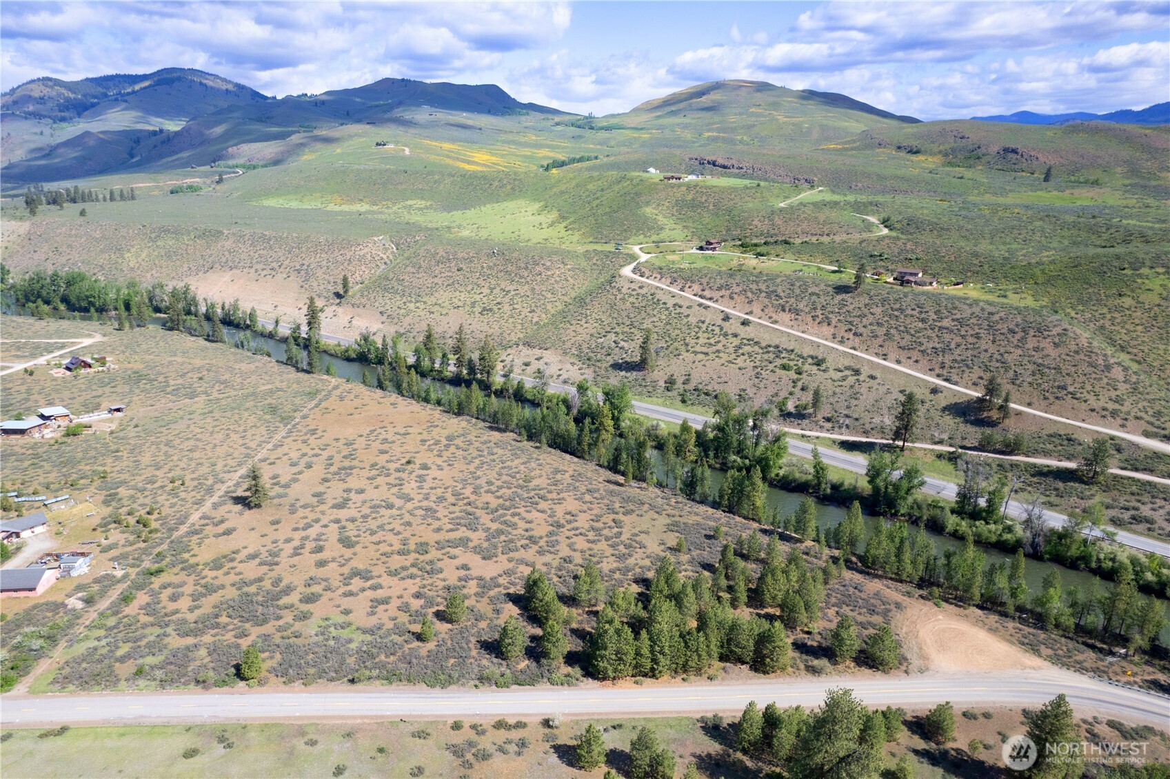 0 Wolf Creek Road Winthrop, WA 98862 - Photo 11 of 40 a view of a lake with a mountain