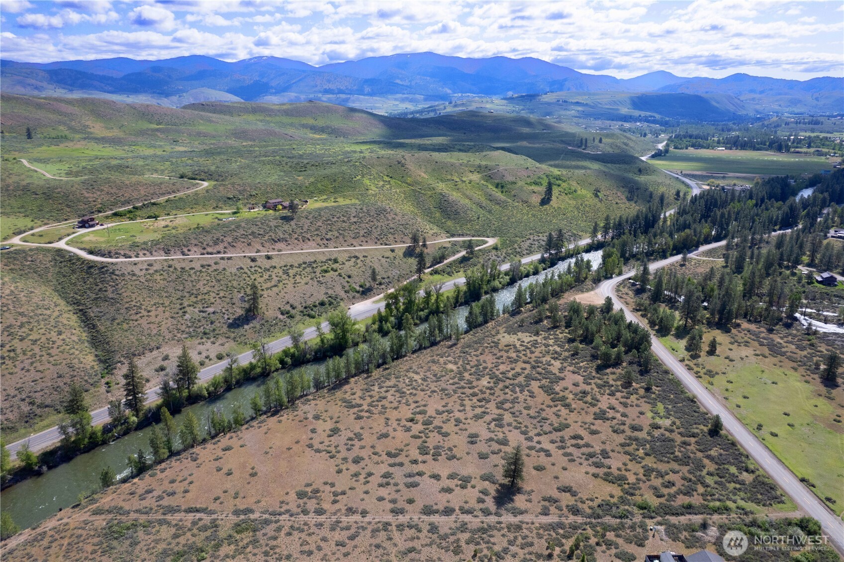 0 Wolf Creek Road Winthrop, WA 98862 - Photo 12 of 40 a view of a street with a mountain