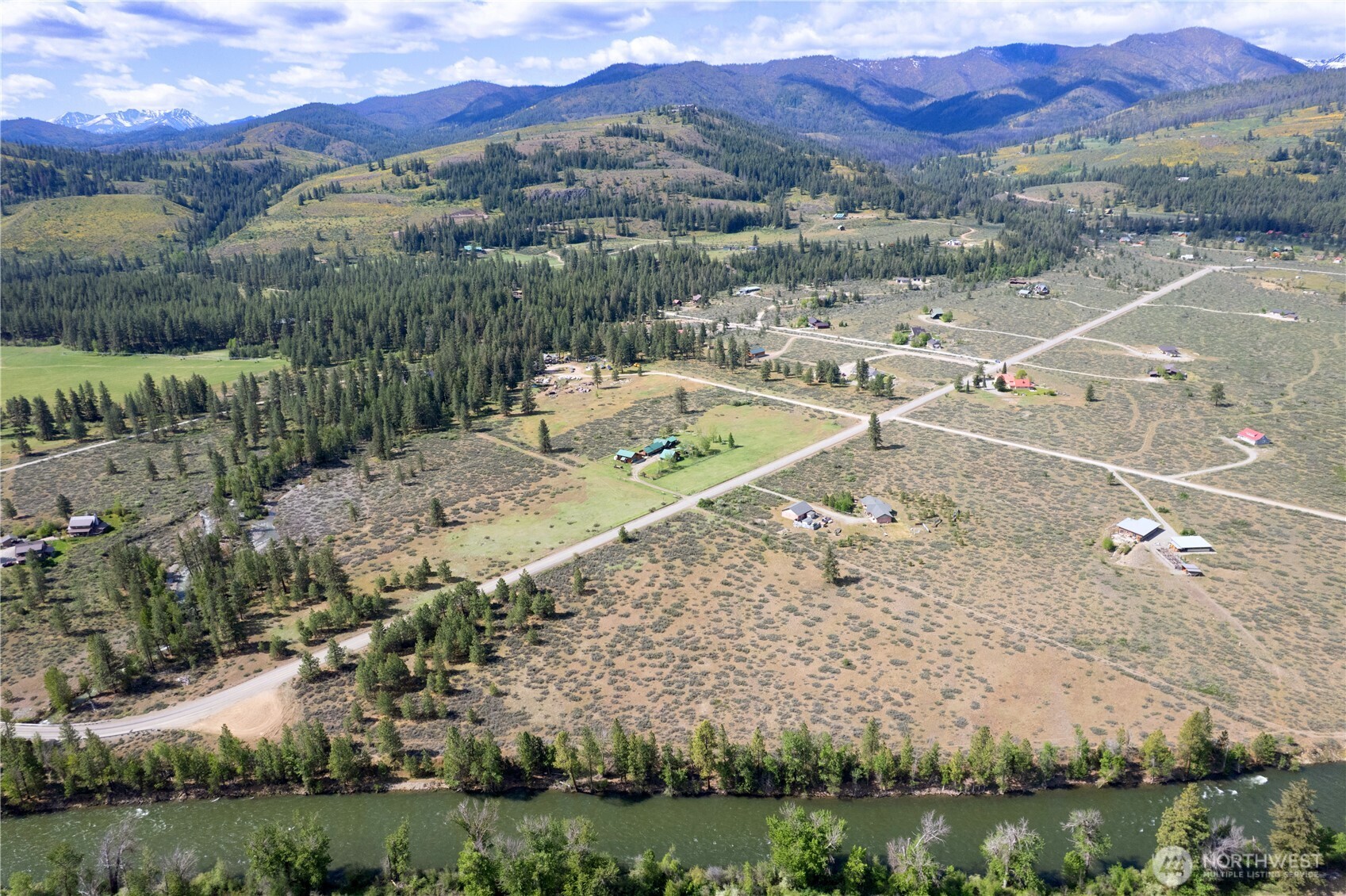 0 Wolf Creek Road Winthrop, WA 98862 - Photo 4 of 40 an aerial view of a house with a garden and mountains