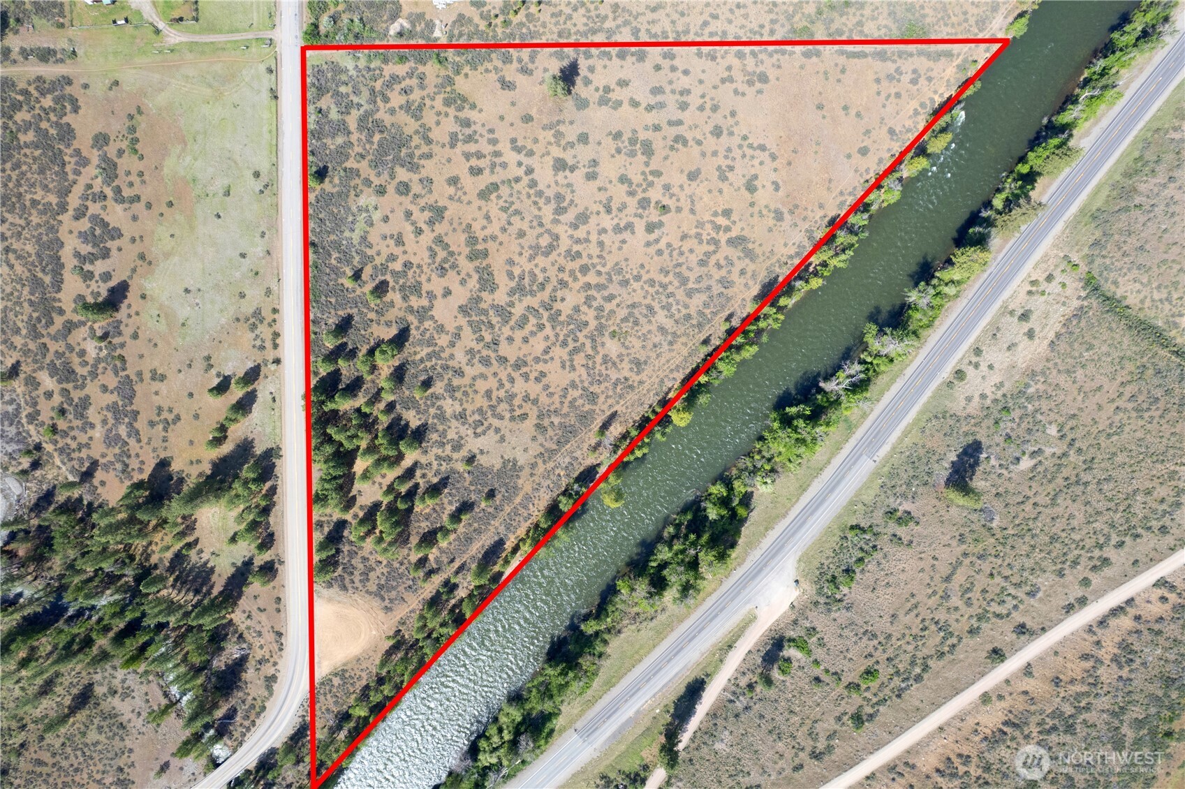 0 Wolf Creek Road Winthrop, WA 98862 - Photo 5 of 40 a view of a yard with wooden fence