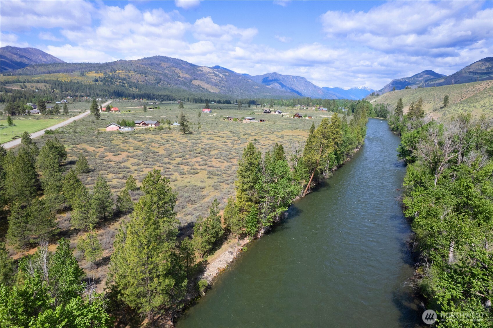 0 Wolf Creek Road Winthrop, WA 98862 - Photo 6 of 40 a view of a lake with a mountain in the background