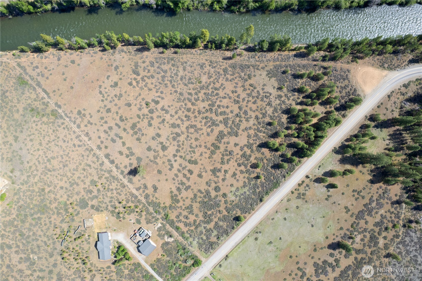 0 Wolf Creek Road Winthrop, WA 98862 - Photo 10 of 40 a view of a lake with a yard