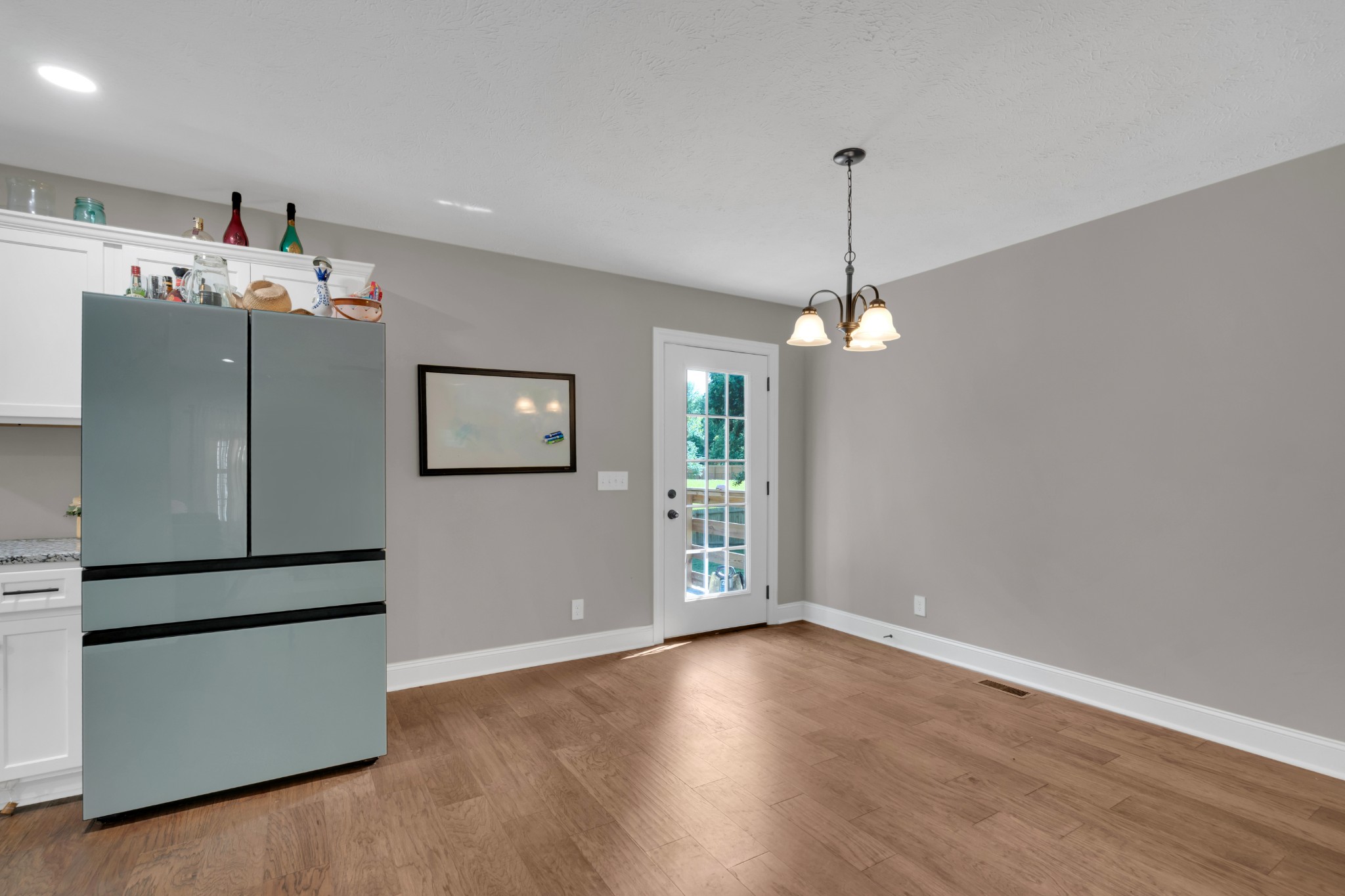 1147 Mt Herman Road Fayetteville, TN 37334 - Photo 8 of 31 a view of a kitchen with a refrigerator ceiling fan and wooden floor