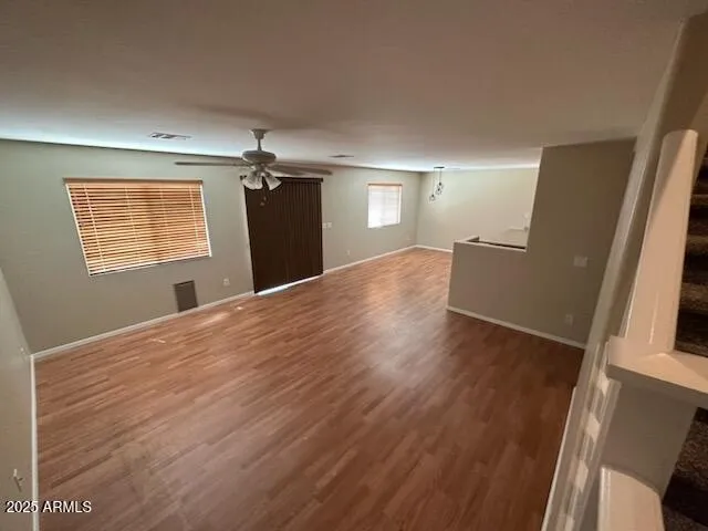 a view of a room with wooden floor and a sink