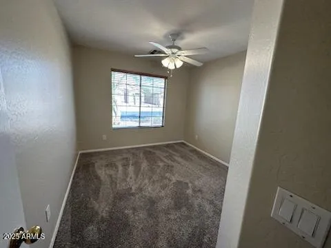 a bathroom with a sink and mirror with toilet