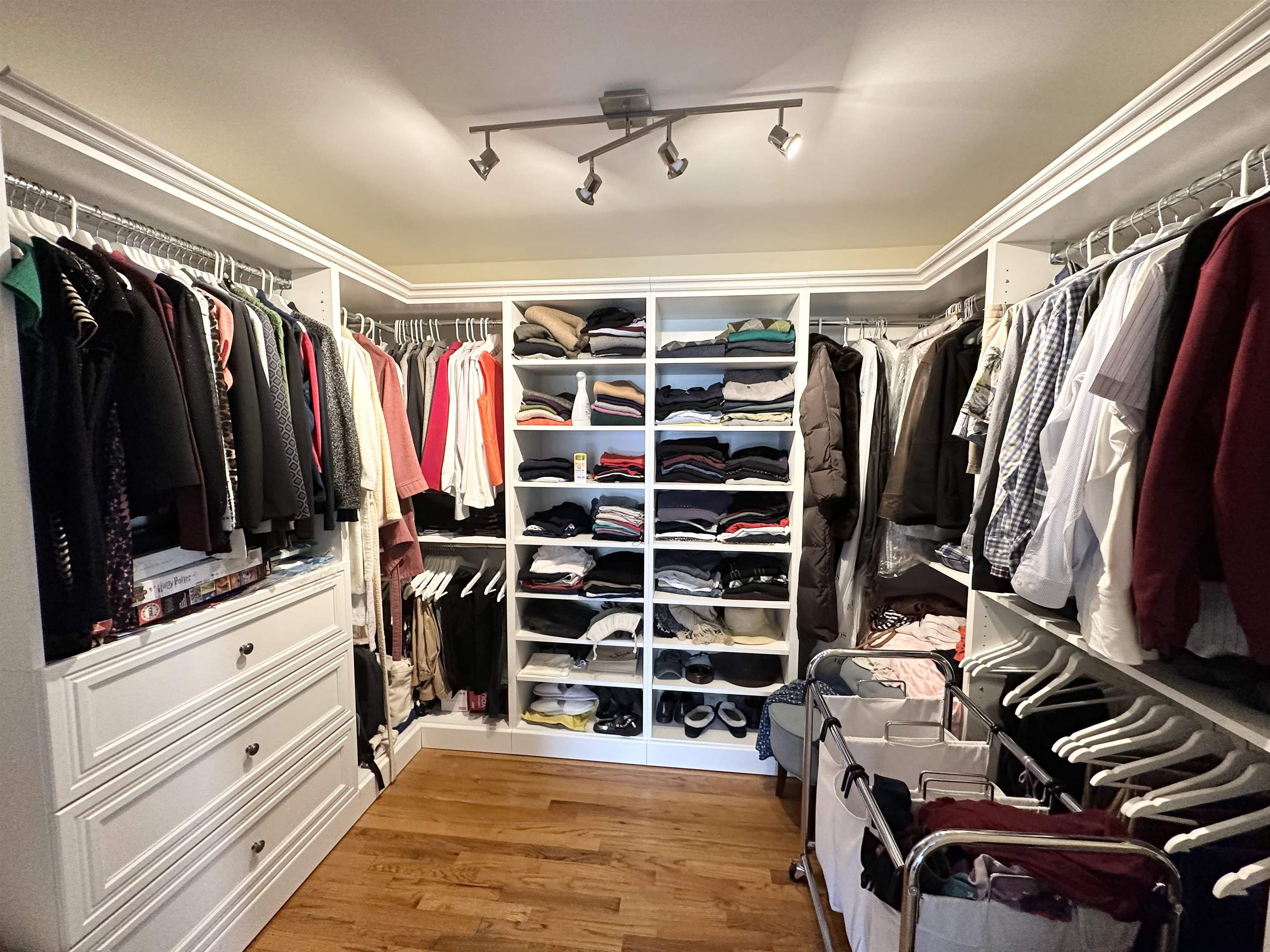 24 Bergen Ridge Road, Unit 1 North Bergen, NJ 07047 - Photo 9 of 17 a view of walk in closet with clothes and shoes