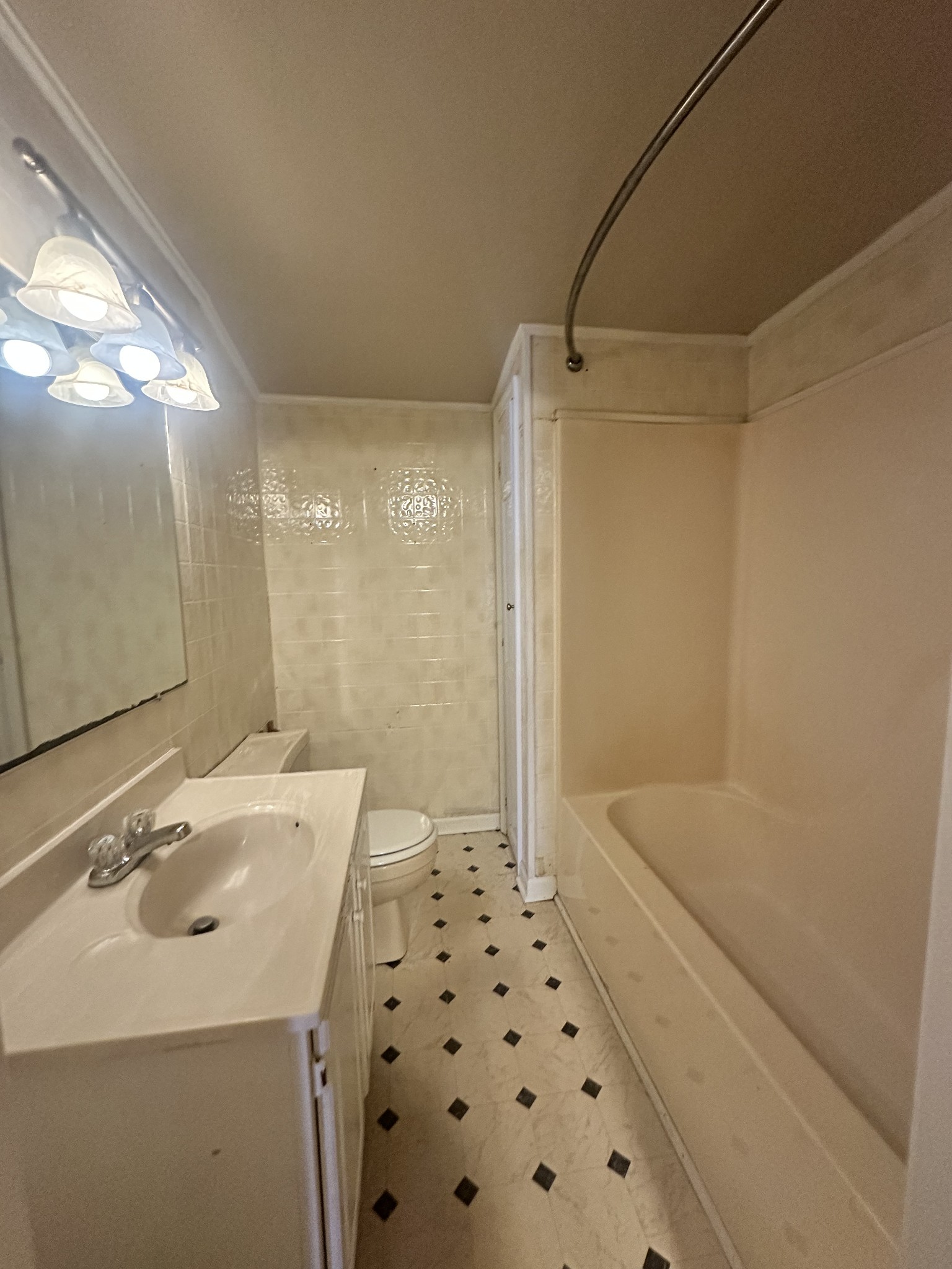 204 Ruby Street Winchester, TN 37398 - Photo 12 of 14 a bathroom with a sink a toilet a shower and a mirror