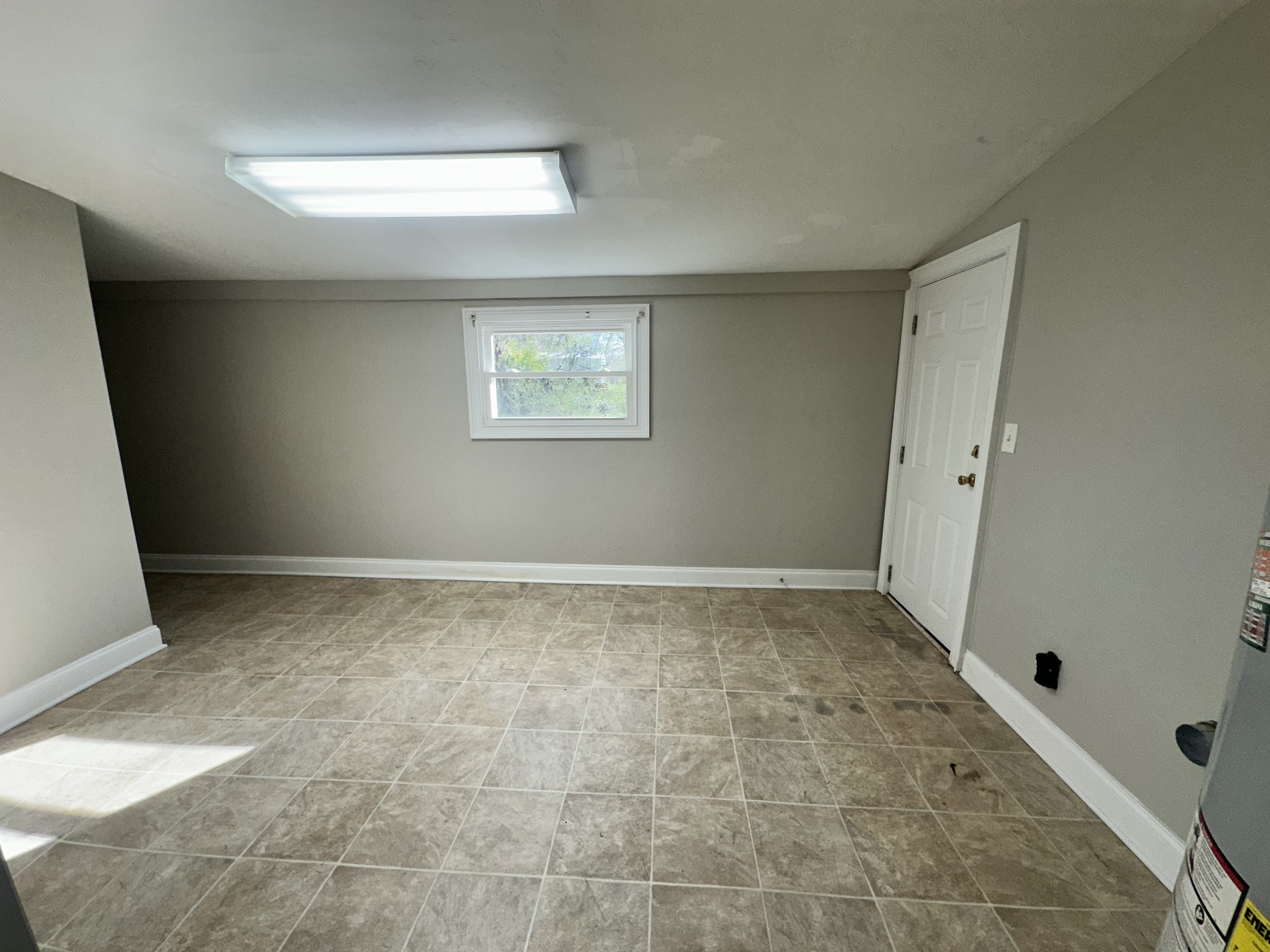 204 Ruby Street Winchester, TN 37398 - Photo 13 of 14 a view of a room with a wooden floor and a window
