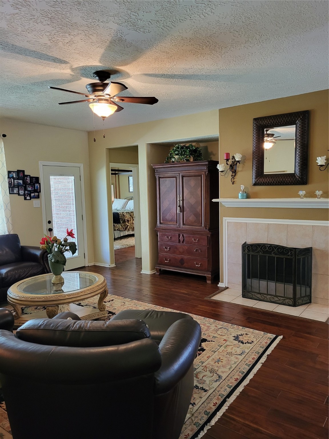 20226 Entrada Court Humble, TX 77346 - Photo 16 of 29 Yet another view of the den with fireplace and large art niche for your entertainment equipment & entrance to the primary bedroom.