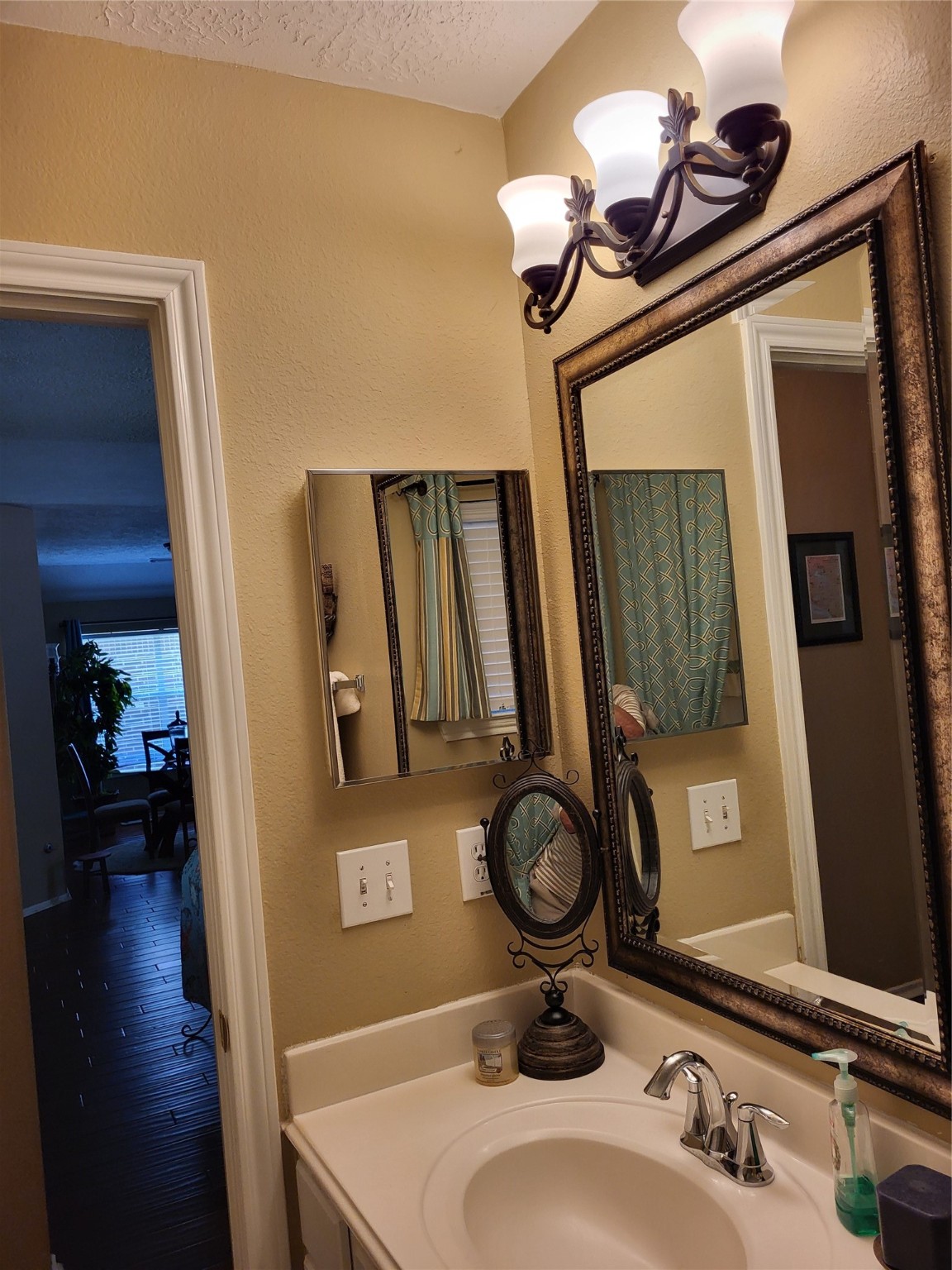 20226 Entrada Court Humble, TX 77346 - Photo 24 of 29 a bathroom with a sink a mirror and vanity