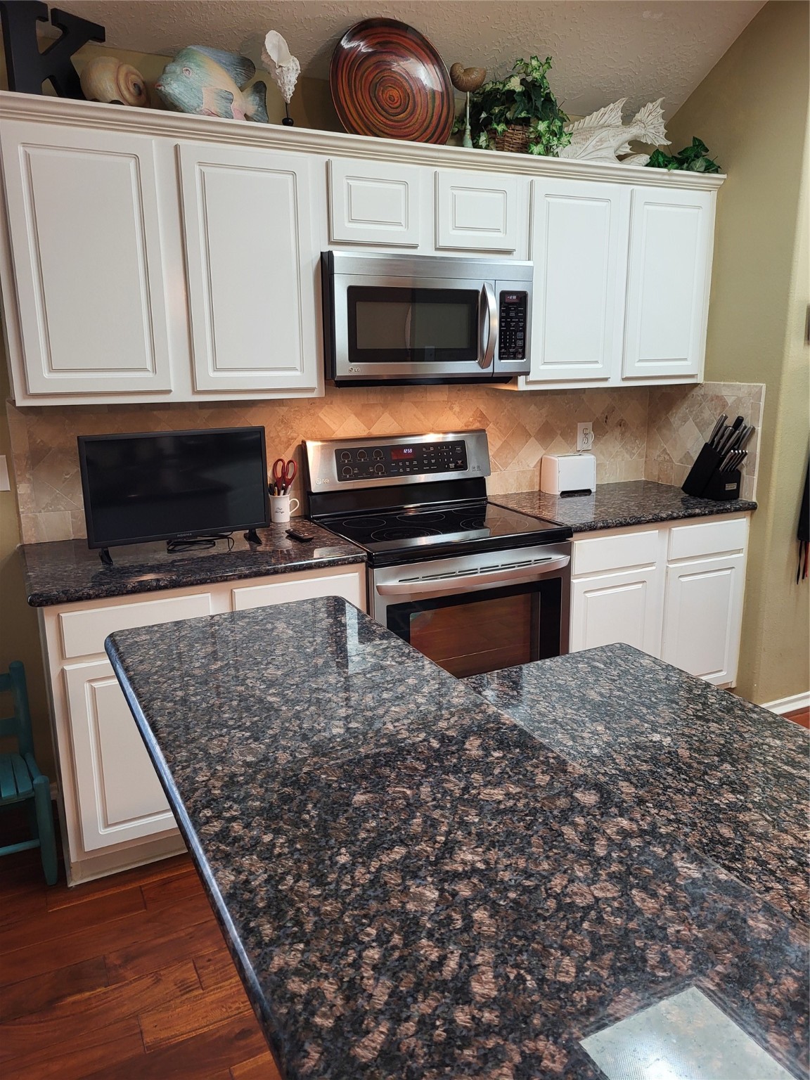 20226 Entrada Court Humble, TX 77346 - Photo 9 of 29 a kitchen with stainless steel appliances granite countertop a stove microwave and sink