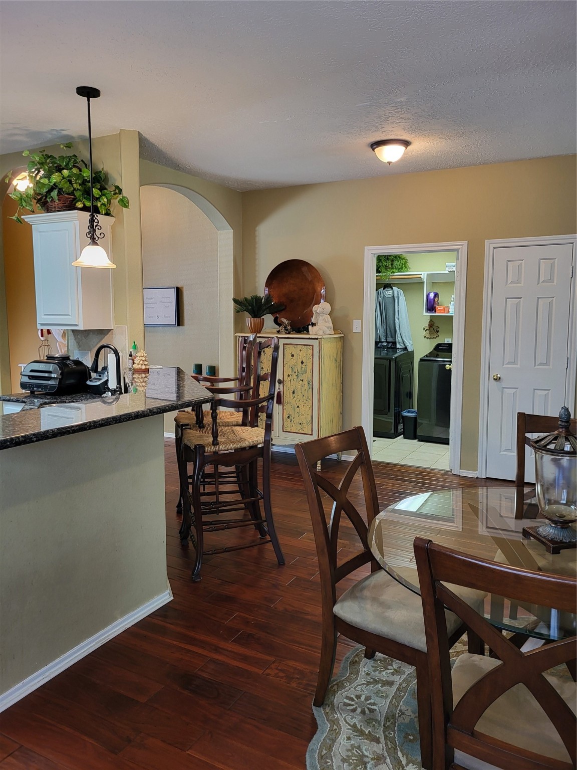 20226 Entrada Court Humble, TX 77346 - Photo 10 of 29 a view of a dining room with furniture and wooden floor