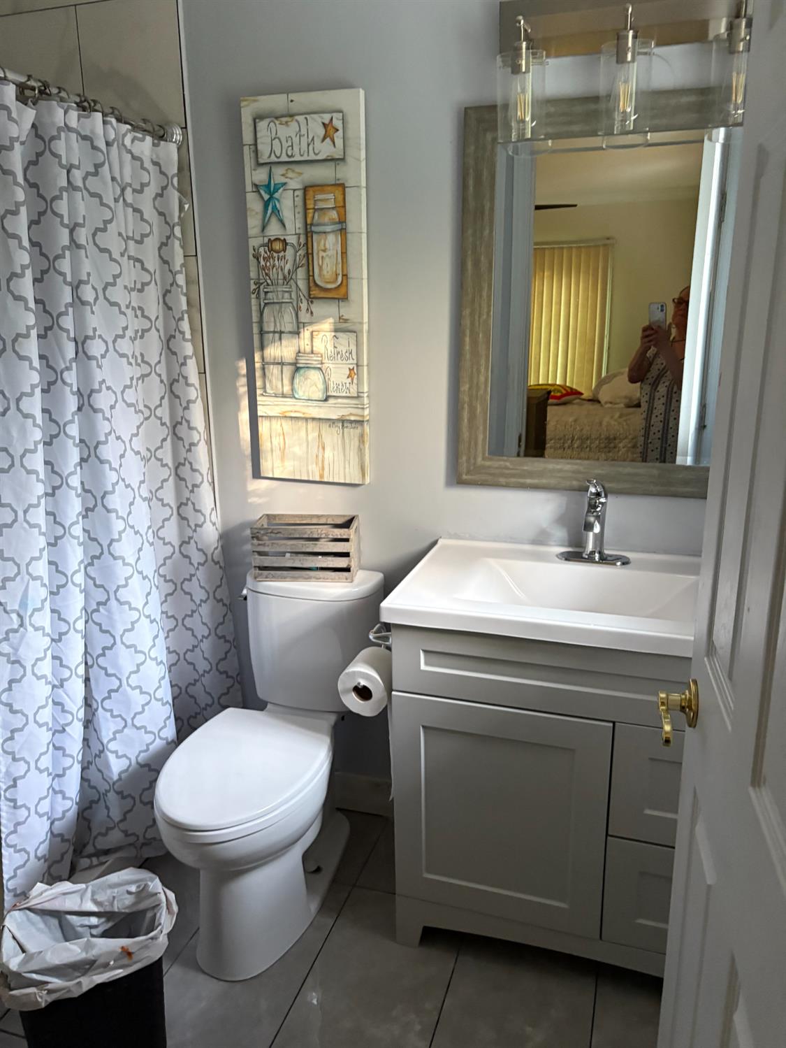 8415 Winding Way Fair Oaks, CA 95628 - Photo 19 of 27 a bathroom with a toilet sink and mirror