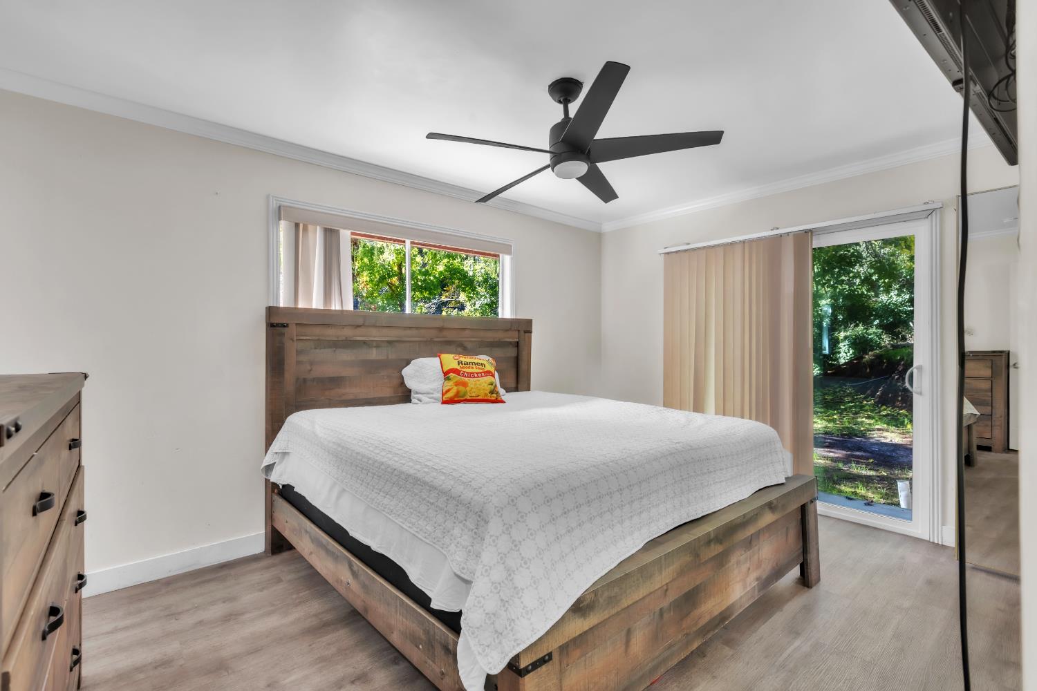 8415 Winding Way Fair Oaks, CA 95628 - Photo 5 of 27 a bedroom with a bed and a window