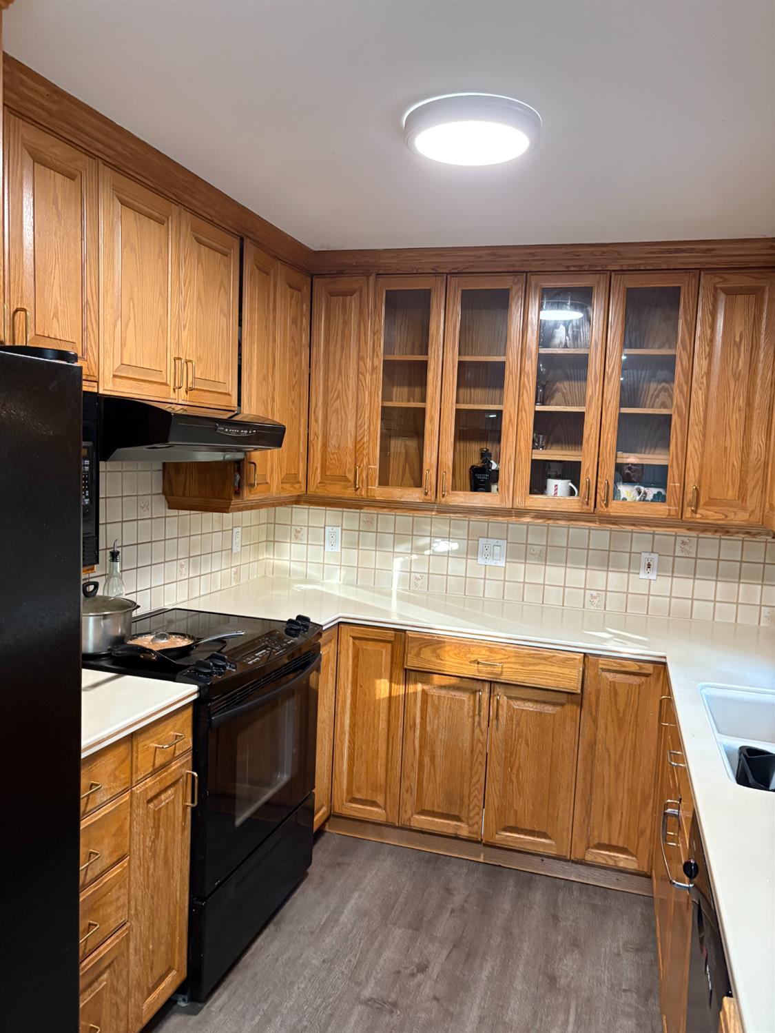 8415 Winding Way Fair Oaks, CA 95628 - Photo 7 of 27 a kitchen with stainless steel appliances granite countertop a sink stove and cabinets