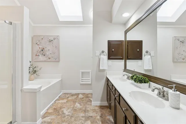 a bathroom with a bathtub sink and mirror