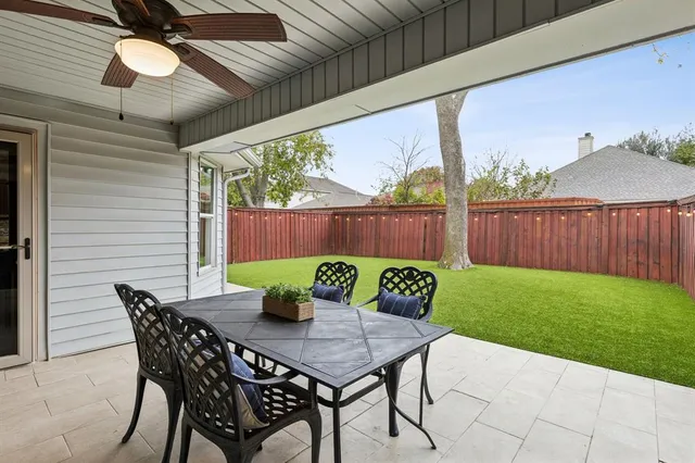 a view of an outdoor sitting area with furniture and wooden floor