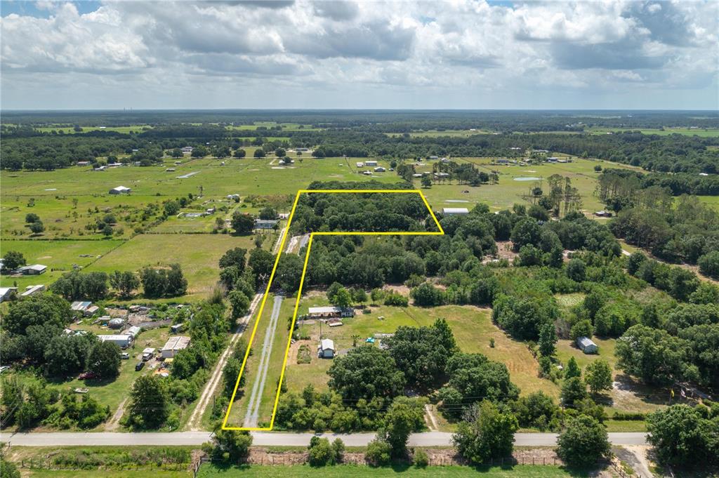 15079 Brahma Road Polk City, FL 33868 - Photo 39 of 40 an aerial view of residential building and lake