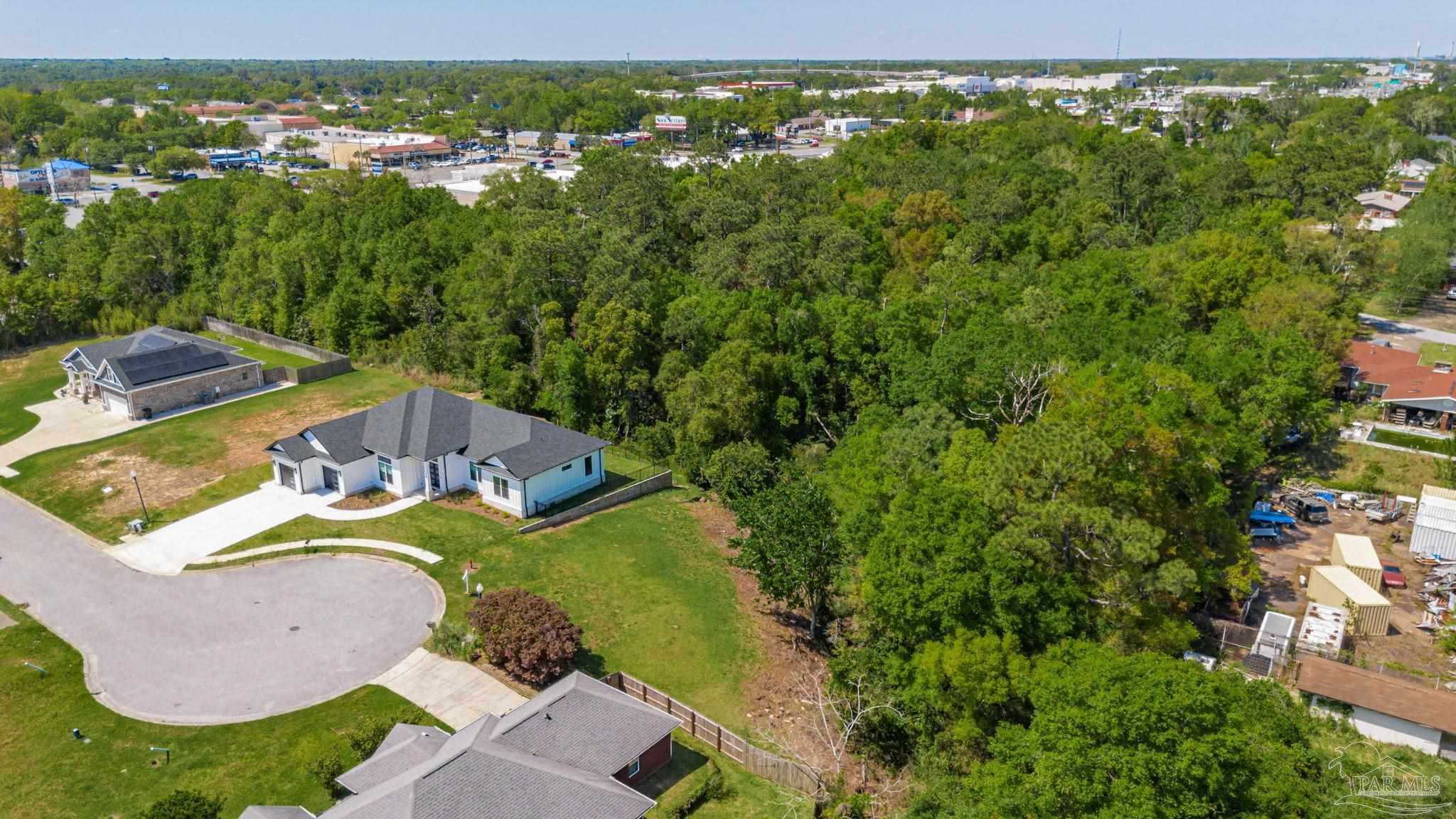 675 Farmington Road Pensacola, FL 32504 - Photo 12 of 19 an aerial view of residential house with outdoor space and swimming pool
