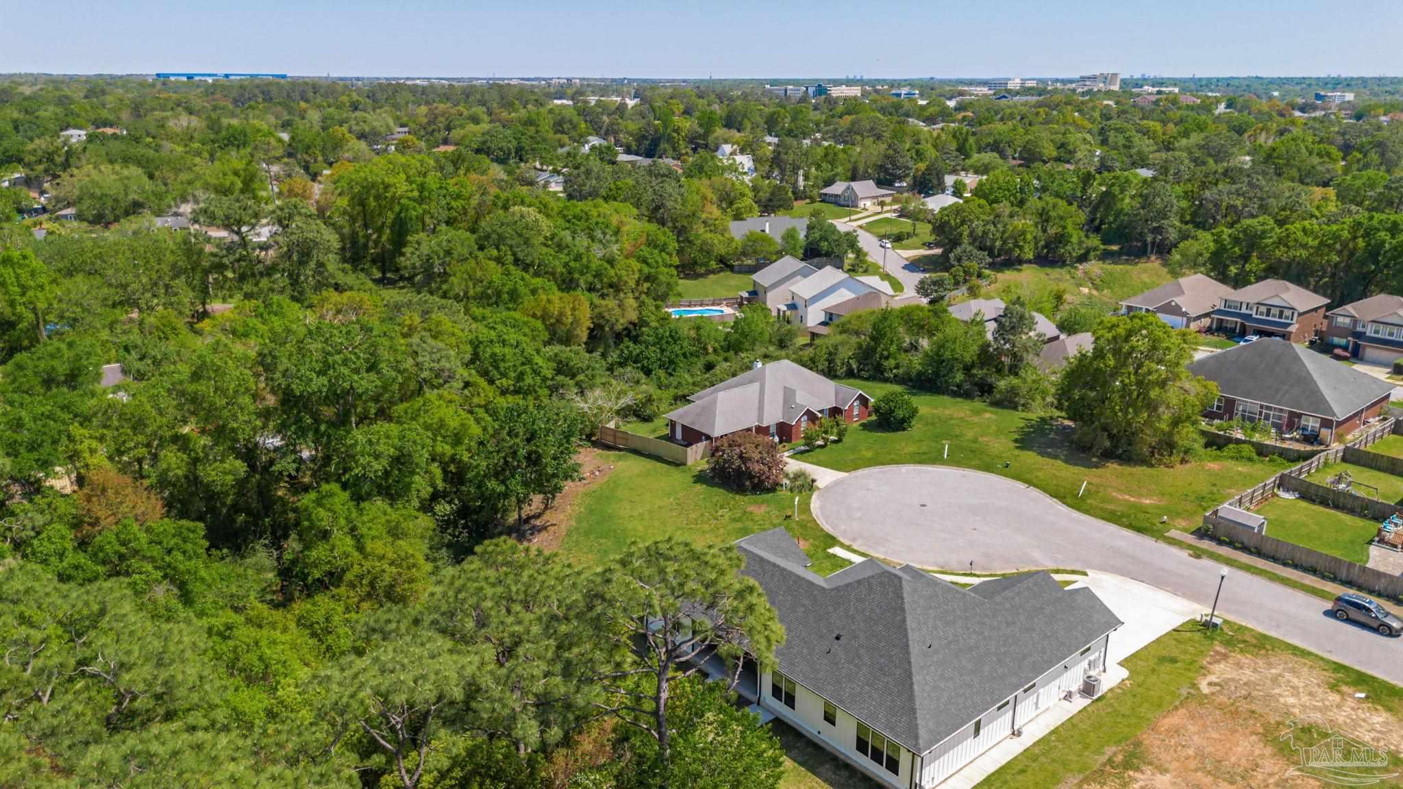 675 Farmington Road Pensacola, FL 32504 - Photo 15 of 19 an aerial view of a house with a yard and lake view