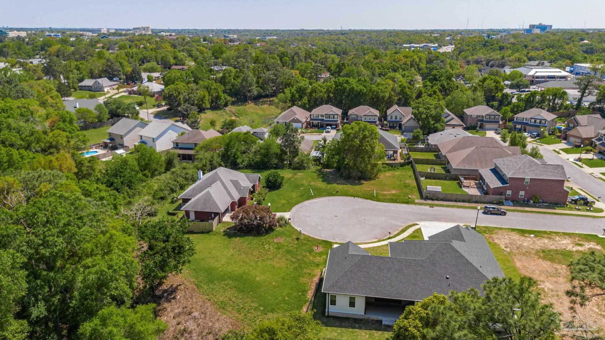675 Farmington Road Pensacola, FL 32504 - Photo 6 of 19 an aerial view of house with yard swimming pool and mountains