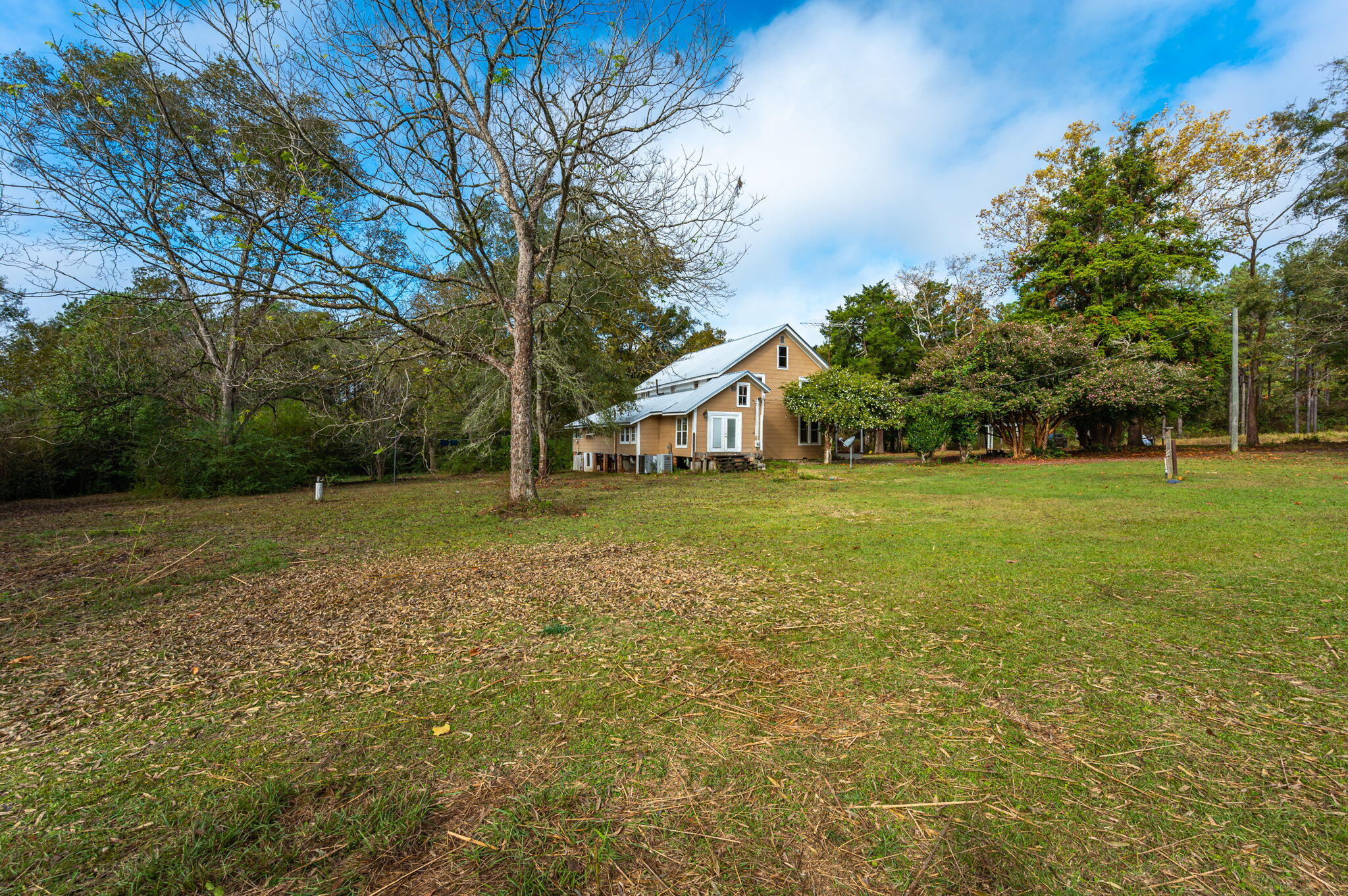 1390 Baker Manning Loop Ponce de Leon, FL 32455 - Photo 46 of 49 a view of a house with yard and tree s