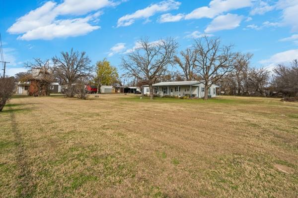 4861 E Highway Springtown, TX 76082 - Photo 14 of 29 a view of a large trees with lawn chairs