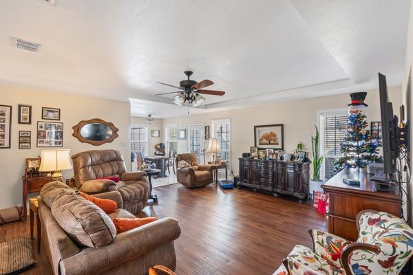 4861 E Highway Springtown, TX 76082 - Photo 21 of 29 a living room with furniture and a chandelier