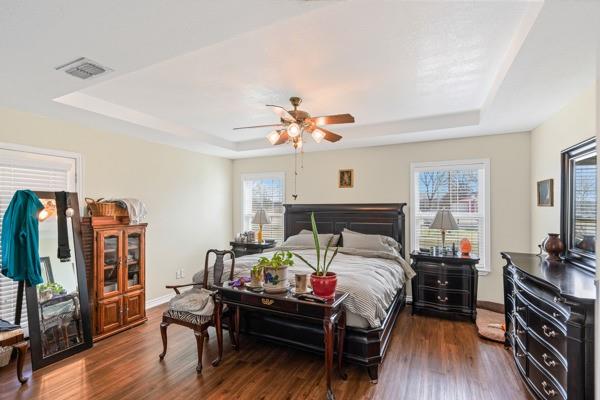 4861 E Highway Springtown, TX 76082 - Photo 23 of 29 a bed room with furniture and a chandelier