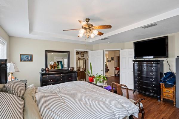 4861 E Highway Springtown, TX 76082 - Photo 24 of 29 a bedroom with a bed and a flat screen tv