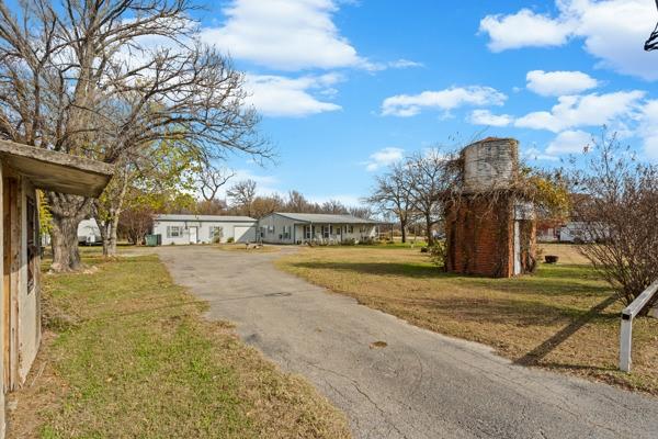 4861 E Highway Springtown, TX 76082 - Photo 6 of 29 a view of a street with houses