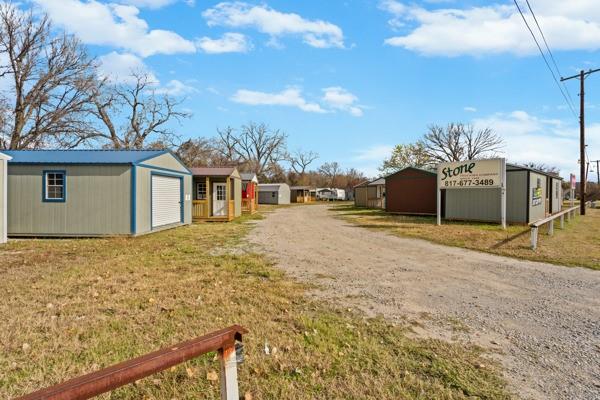 4861 E Highway Springtown, TX 76082 - Photo 7 of 29 a backyard of a house with table and chairs