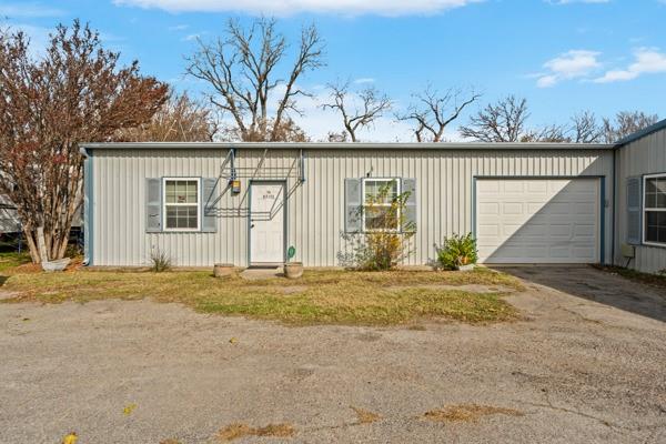 4861 E Highway Springtown, TX 76082 - Photo 10 of 29 a view of a house with a yard and garage