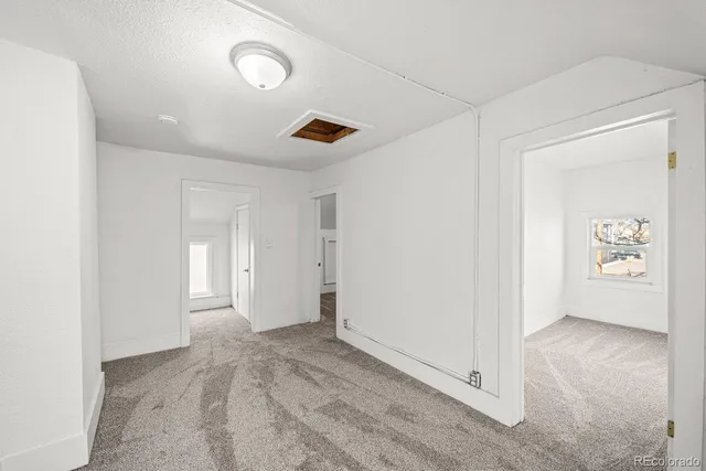 a view of an empty room and window