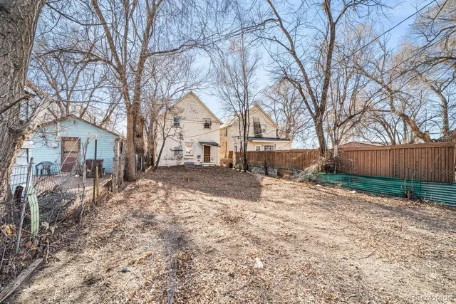 a view of a yard covered with snow in the front