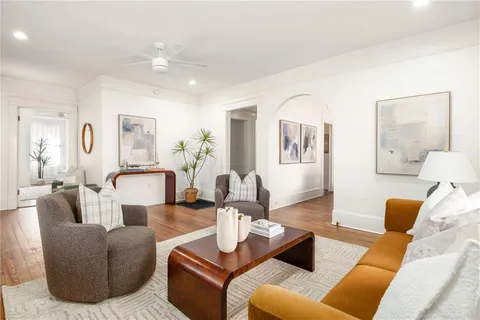 a living room with furniture or couch and a potted plant