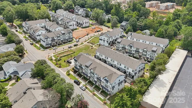 an aerial view of a city with lots of residential buildings